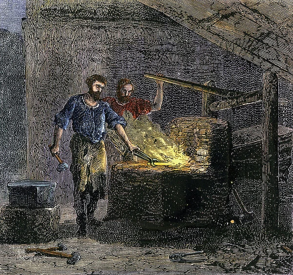 Blacksmith and his assistant in a forge working