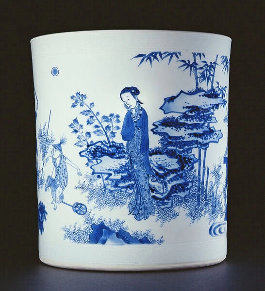 Blue and white brushpot painted with a lady and boys playing on hobbyhorses in a garden