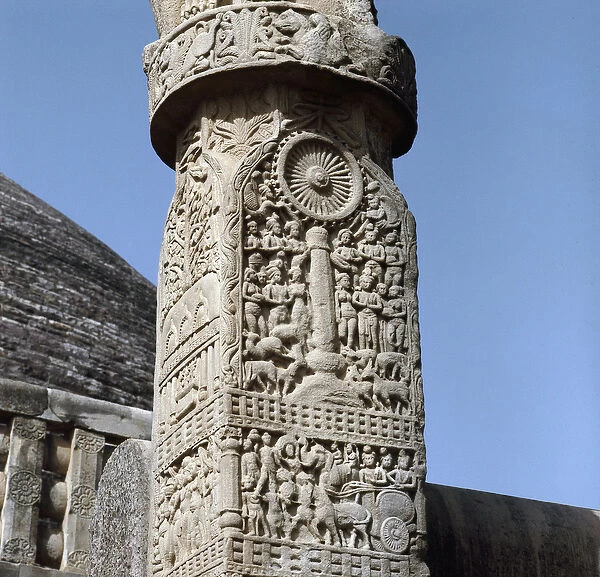 The buddhist wheel. Carved decoration of the southern gateway to the Great Stupa of