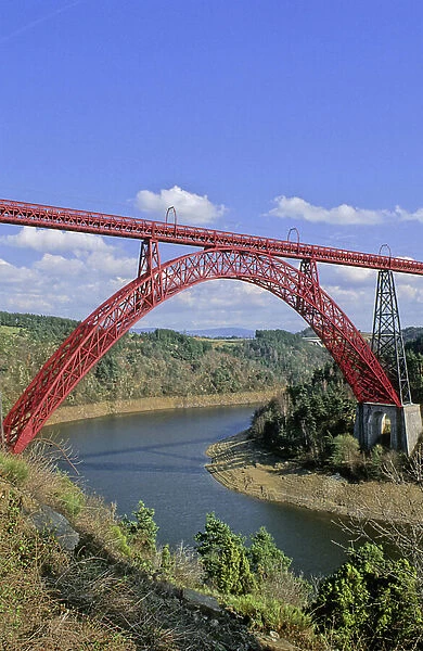 The Garabit viaduct (rail bridge) in the Cantal in Auvergne (France) crosses the waters of the dam's reservoir lake. Architecture by Gustave Eiffel, 1881-1884