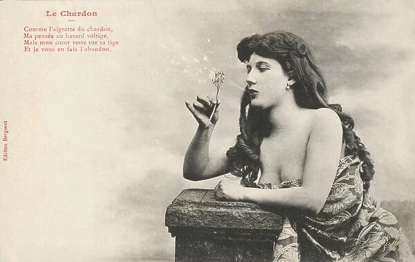 Girl blowing a dandelion (b  /  w photo)