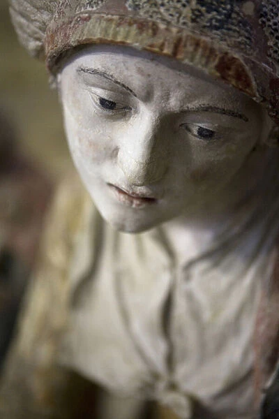 Holy woman in a bonnet (painted stone)