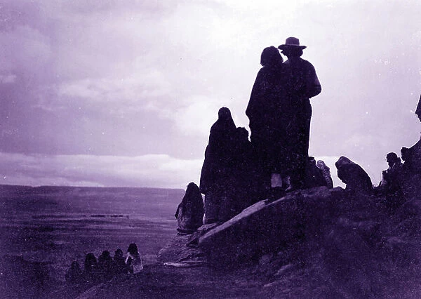 Hopi Indians looking into the distance at valley floor