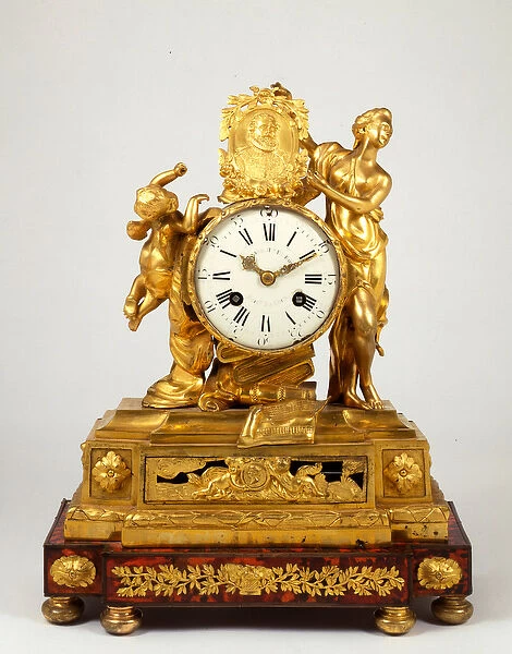 A late Louis XV ormolu mantel clock with a profile medallion of Henri IV held by Venus