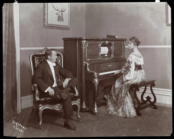 Man and woman playing a player piano, New York, 1907 (silver gelatin print)