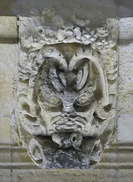 Mascaron reading in the place and in the reverse detail of the facade of the Renaissance Hotel 1544, place des Petites benches, La Rochelle (17000), Charente-Maritime
