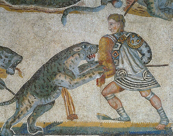 Mosaic showing a scene of a wild beast hunt, detail of a gladiator killing a wild animal
