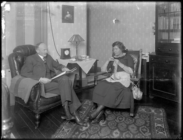 Mr. and Mrs. Austin Norris in unidentified living room, c. 1912 (b  /  w photo)