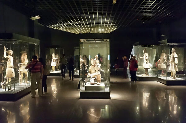 Museum; standing warriors painted with original colour in glass display cases
