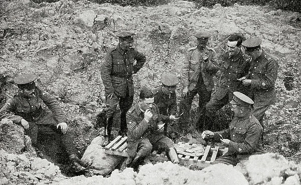 The Opportunists. Warrant Officers and N.C.O.'s playing cards in a shell hole in 1917