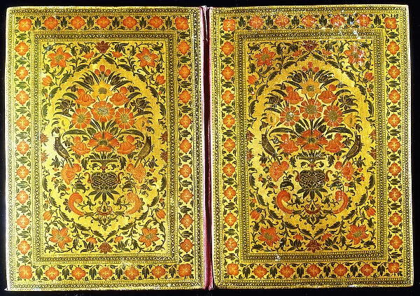 A pair of lacquer bookcovers decorated with a floral design