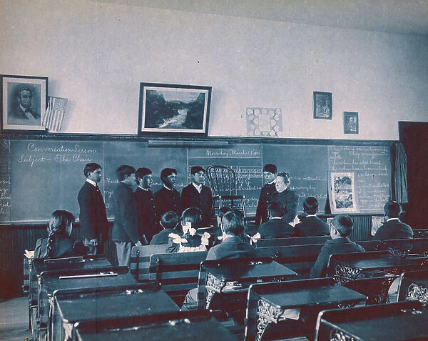 Photographic print of boys having conversation lessons by Frances Benjamin Johnston
