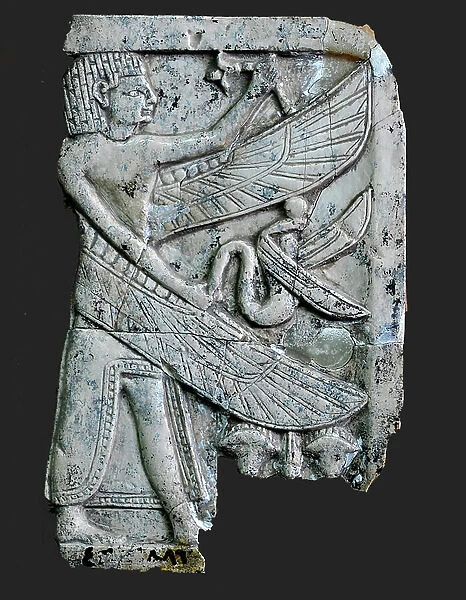 Plaque of an Egyptian styled winged man holding a snake. Nimrud, Mesopotamia, c.9th-8th century BC (ivory)
