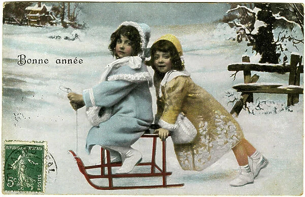 Postcard, New Year's Greetings 'Happy New Year', two girls in sledge on snow. The beginning of the 20th century