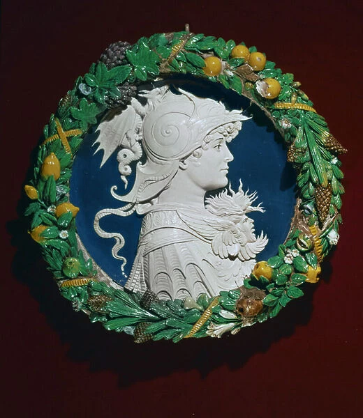 Roundel bearing a profile portrait of Alexander the Great surrounded by a garland of foliage, Florence, c. 1480 (terracotta with polychrome glaze)