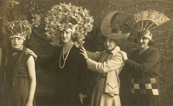 Row of four women in spectacular hats (b  /  w photo)