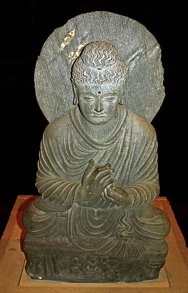 Seated Buddha from Gandhara, shows him as a teacher. Pakistan, about 2nd - 3rd century AD