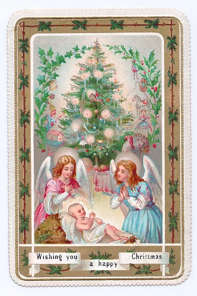 Victorian Christmas card of two angels praying over baby Jesus in front of a Christmas