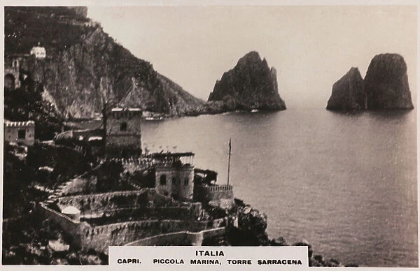 View of the marina of Capri with the stacks and the ancient Saracen tower, no longer existing
