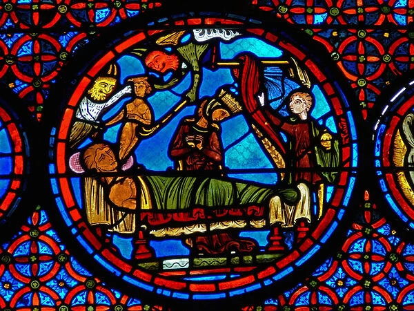 Detail from a window depicting the parable of Lazarus and Dives (stained glass)