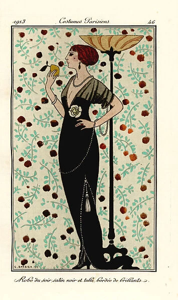 Woman in evening gown of black satin and tulle, edged with brillants. Robe de soir satin noir et tulle, bordee de brillants. Handcoloured pochoir (stencil) etching after an illustration by George Barbier from Tommaso Antongini