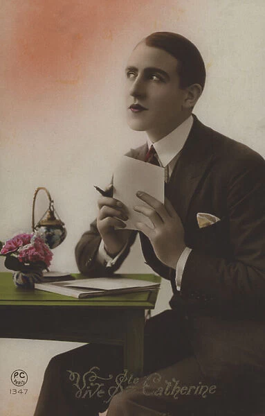 Young man writing a letter (colour photo)