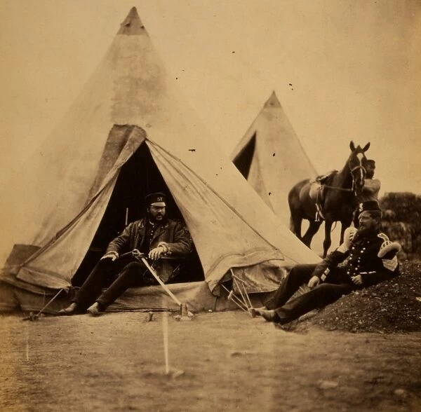 Officer of the 57th Regiment sitting with a sword across his lap at opening to his tent