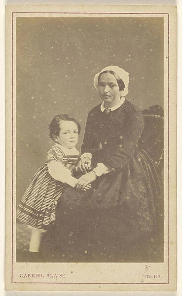 woman seated little girl standing next Gabriel Blaise