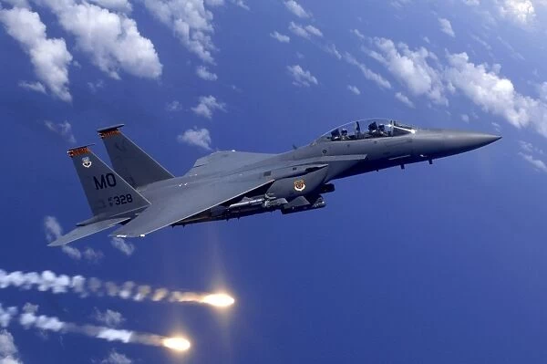 An Air Force F-15E Strike Eagle fires flares during an aerial training dog fight