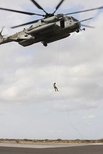 An Air Force pararescueman conducts a combat insertion and extraction exercise in Djibouti