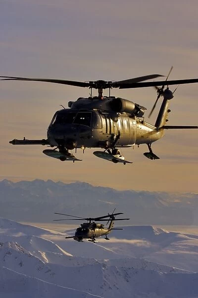 Two Alaska Air National Guard HH-60G Pave Hawks in flight over Alaska