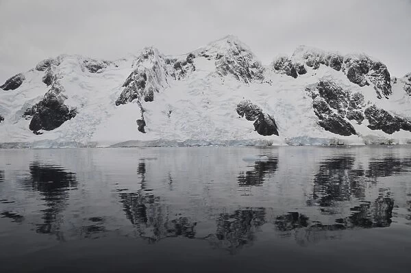 Antarctic mountains reflected in the sea, Antarctica