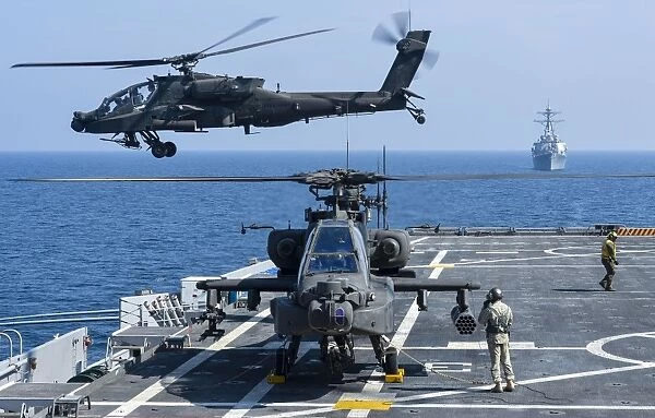 An Army AH-64D Apache helicopter takes off from USS Ponce