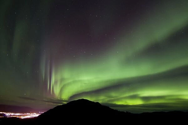 Aurora borealis over Gray Peak, Whitehorse, Yukon Canada