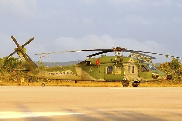 Brazilian Air Force UH-60 helicopter at sunset