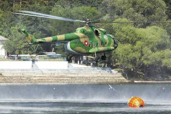Bulgarian Air Force Mi-17 taking water with Bambi Bucket