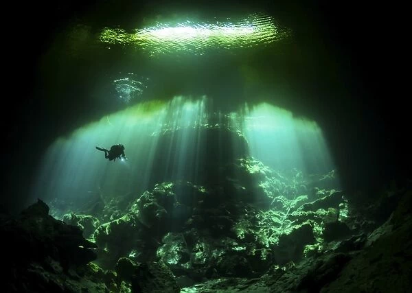 A diver in the Garden of Eden cenote system in Mexico