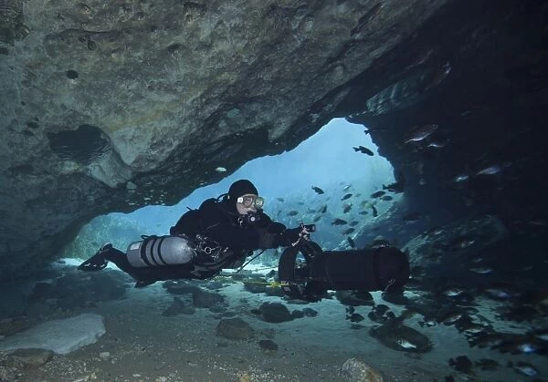 A diver using a diver propulsion vehicle in the Blue Springs cave system