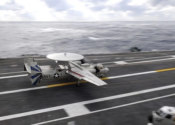 An E-2C Hawkeye conducts a touch-and-go landing aboard USS Dwight D. Eisenhower