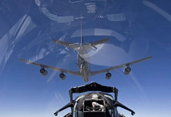 An F-15 Eagle pulls into position behind a KC-135 Stratotanker