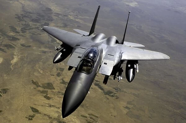 An F-15E Strike Eagle aircraft in flight over Afghanistan