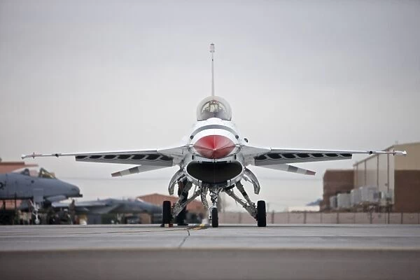 An F-16C Thunderbird sits on the ramp at Nellis Air Force Base, Nevada