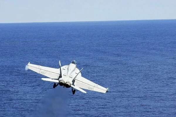 An F  /  A-18E Hornet taking off from USS George Washington