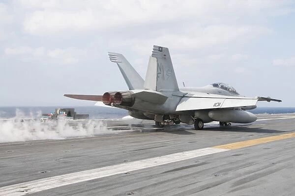 An F  /  A-18F Super Hornet launches from the flight deck of USS George Washington