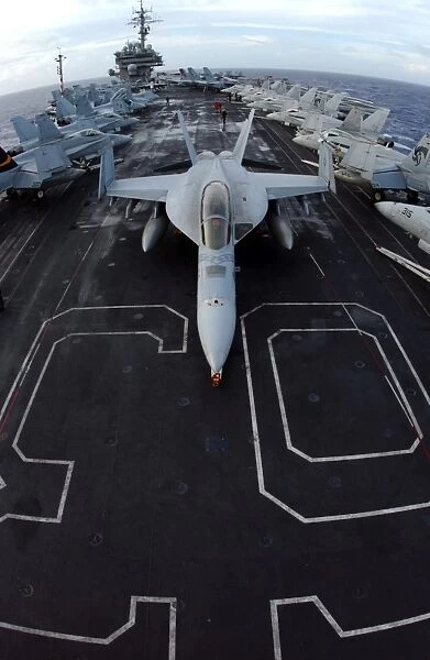 An F  /  A-18F Super Hornet of Strike Fighter Squadron 102 parked on the bow of the USS