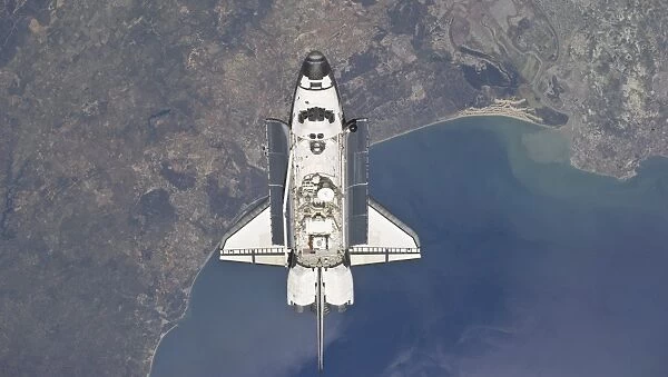 Flying above the Atlantic coast of Spain and the Gulf of Cadiz, the space shuttle