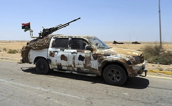 A Free Libyan Army pickup truck with a ZPU-1 anti-aircraft gun, Ajdabiya, Libya