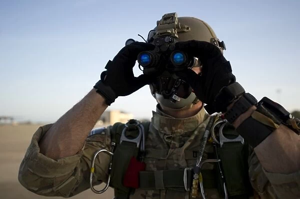 A Green Beret checks attached night vision device