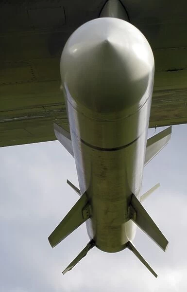 A harpoon missile attached to the wing of a P-3 Orion