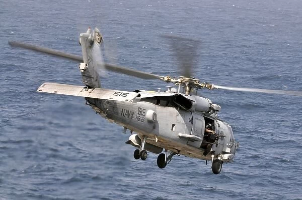 An HH-60H Sea Hawk helicopter in flight
